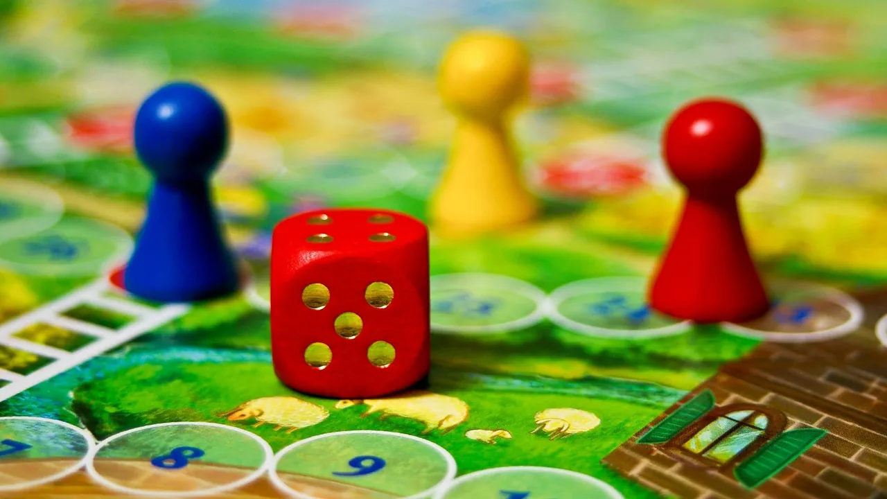 A die and pawns on a game board